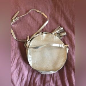 Pale gold circle bag from Anthropologie